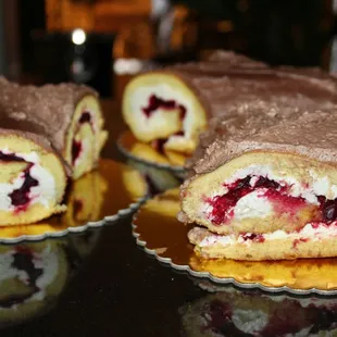 The classic French, yuletide desserts were made from sponge-cake, rolled up and frosted to resemble decorative Yule logs.