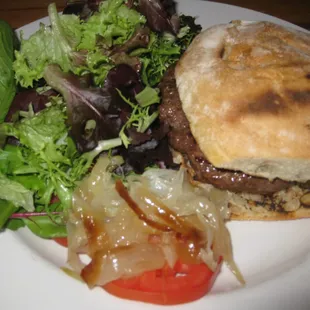 burger with lightly dressed salad
