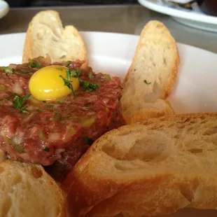Beef tartare &amp; Dijon mustard , capers, shallots , quail egg and toast points.