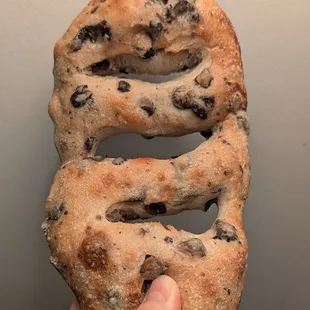 Olive fougasse is my absolute favorite bread. I love the version here - crusty, chewy, and filled with olives.
