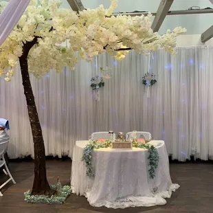 Cool sweetheart table.