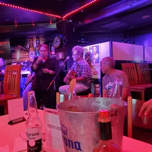 a group of people at a bar
