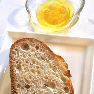 Sourdough bread with strawberry vinegar over olive oil
