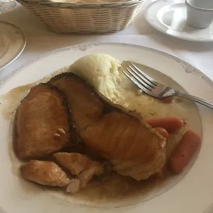 The salmon menuier pictured was delicious. My husband had the seafood crepes that were amazing. We highly recommend the crab cake too.