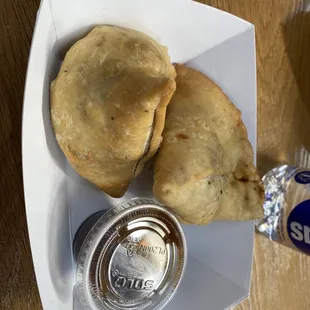 a plate of pastries and a can of soda