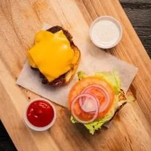 Classic Burger, ground chuck mashed seared, lettuce tomato anion mayo on sesame brioche bun