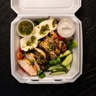 Grilled chicken salad, mix greens tomato, cucumber onion with a side of ranch, balsamic or chimichurri dressing