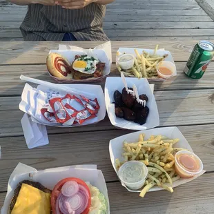 La chavela, the classic and truffle fries along with Salvadoran plantains