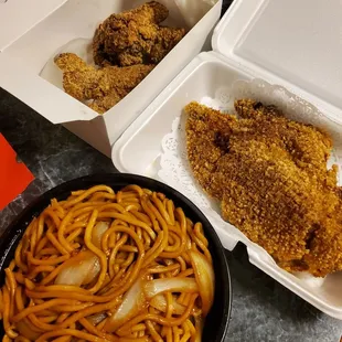 two take out boxes of chicken and noodles