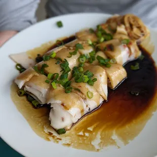 Char siu chang fen (plated at home with sauce and scallions)