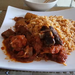 a plate of rice and meat