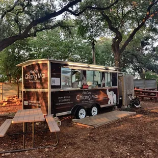a food truck parked in a park