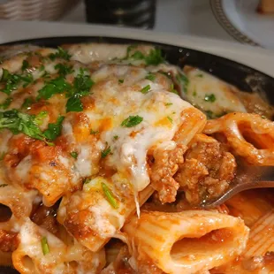 a pasta dish with meat and cheese