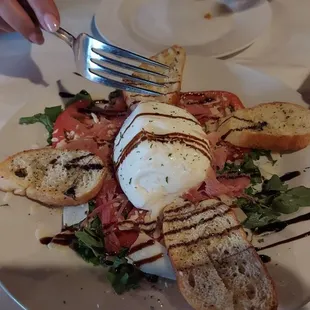 An absolute must get....Burrata caprese with the tomatoes and arugula....absolutely delicious.