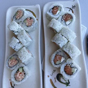 two plates of sushi on a table