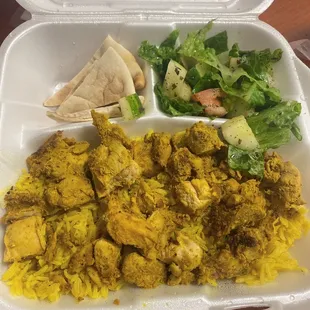 Chicken over rice with pita bread and Greek salad