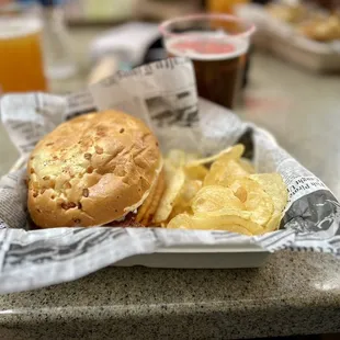 a sandwich and chips in a basket