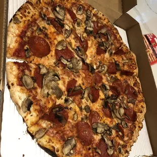 Large pepperoni and mushroom pizza with light cheese
