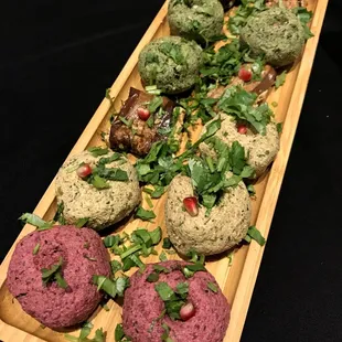 Cold appetizers mix ($19): Nigvziani Badrrijani (walnut garlic paste wrapped in eggplant) and three types of Pkhali (vegetable pâte)