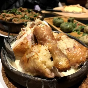 Chkmeruli ($14): Traditional Georgian style oven baked chicken soaked in garlic cream sauce served in a clay pan