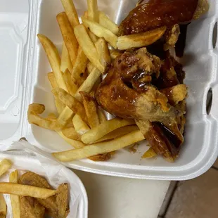 two takeout containers with french fries