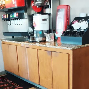 a counter with a coffee machine