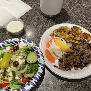 Steak &amp; chicken plate mixed with a GREEK SALAD