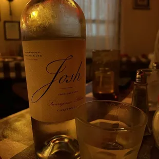 a bottle of wine and a glass