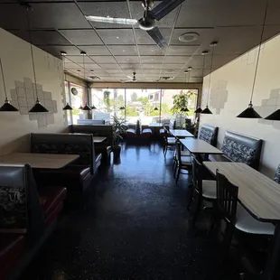 dining area with tables and booths