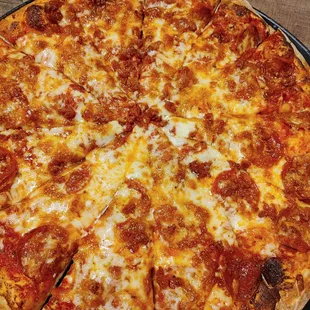 pepperoni and cheese on a pizza pan