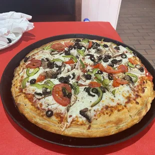 a pizza on a pan on a table