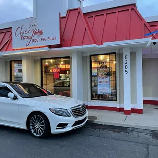 a car parked in front of the restaurant
