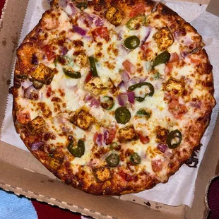 a pizza in a cardboard box