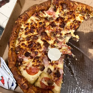 a half eaten pizza in a box