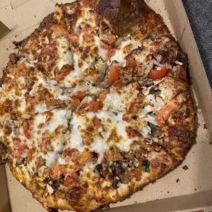 a pizza in a cardboard box