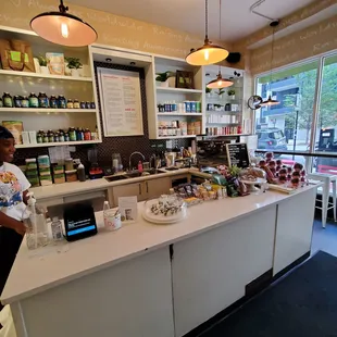 a man standing at a counter in a store