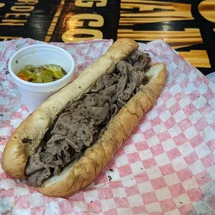 a roast beef sandwich with pickles