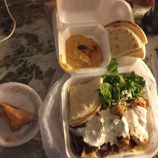 Takeout combo gyro platter with hummus and baklava