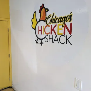 the logo on the wall