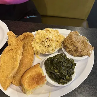 My sister food... Fried Catfish Dinner, greens, cornbread dressing, mac and cheese. She had a waffle that didn&apos;t make the picture