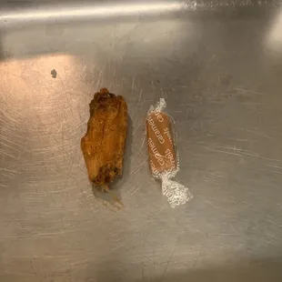 a fried chicken and a piece of bread