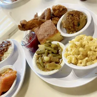 Fried wings, cornbread dressing/cranberry sauce, mac n cheese, green beans, yams, red beans and rice.