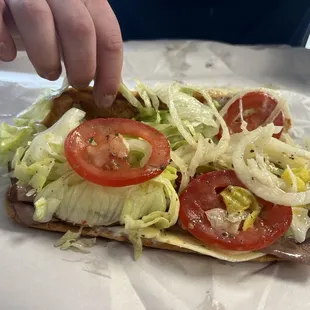 131st St: Roast beef, lettuce, tomatoes, onion, basil, salt, pepperoncino peppers, hot giardiniera mix, hoagie sauce, cheese, &amp; mayo