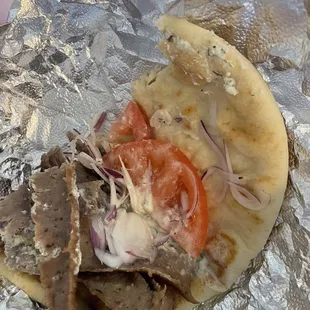 My half eaten Gyro shows the tomato, onion and sauce