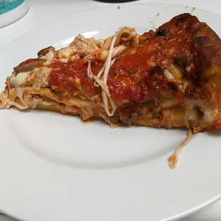 A slice of "pizza cake" , we weighed it in our office and it's about 13 oz per slice.