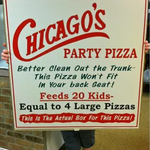 a woman holding a chicago's party pizza sign