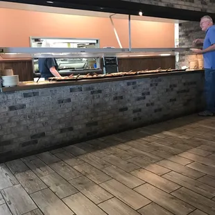 a man standing in front of a counter