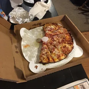 a slice of pizza in a box