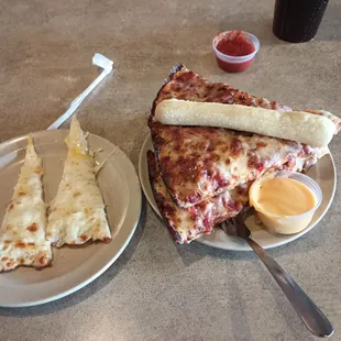 a plate of pizza and a slice of pizza