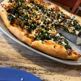 X large pie with spinach black olives Italian sausage and fresh garlic.